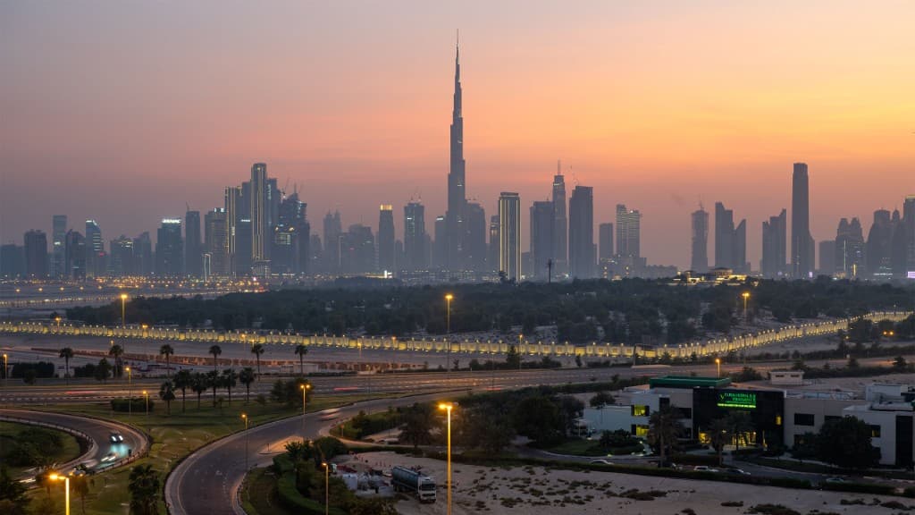 Dubai skyline at sunset with Burj Khalifa and towers in golden light