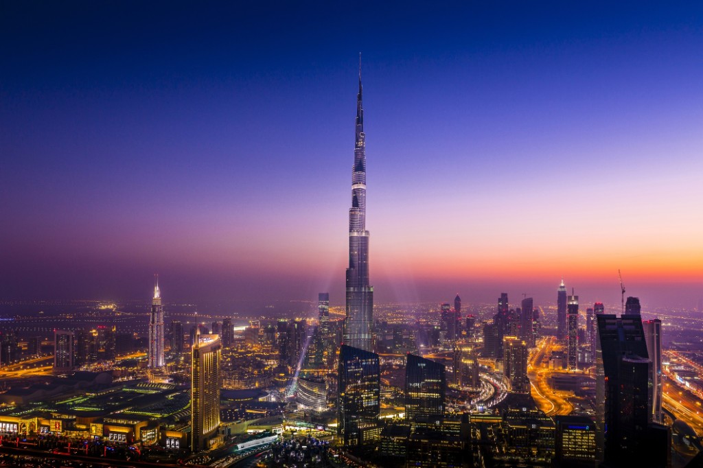 Downtown Dubai skyline at dusk with Burj Khalifa and city lights